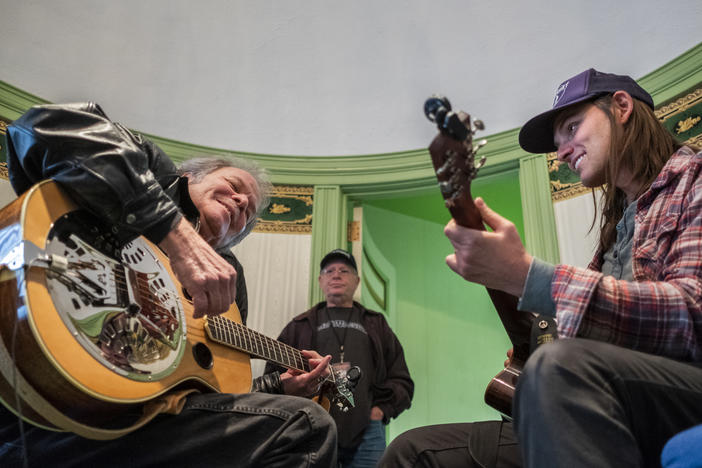 Tommy Talton, left, and Duane Betts, enjoy working out the guitar parts of the Allman Brothers Band's "Little Martha" before soundcheck at the Macon City Auditorium Monday.
