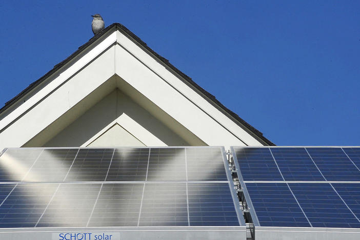 Solar panels on the roof of a home in the Felton Homes public housing complex in Macon in 2014. 