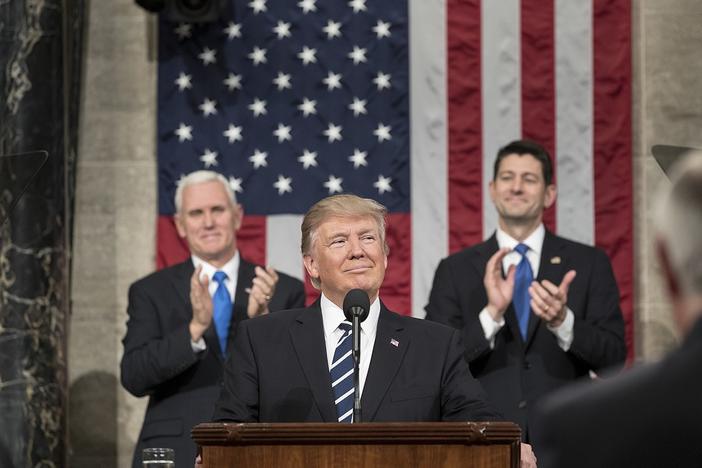 President Donald Trump addressing Congress, with Vice President Mike Pence and House Speaker Paul Ryan.
