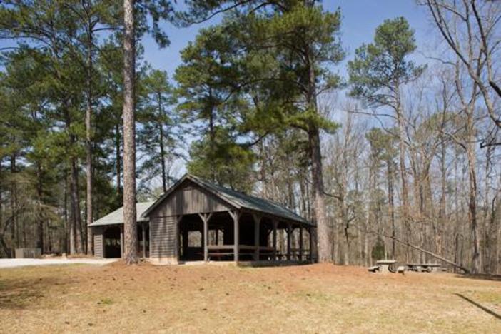 The first patient to arrive at the state's isolation camp at Hard Labor Creek State Park volunteered to go, officials said.