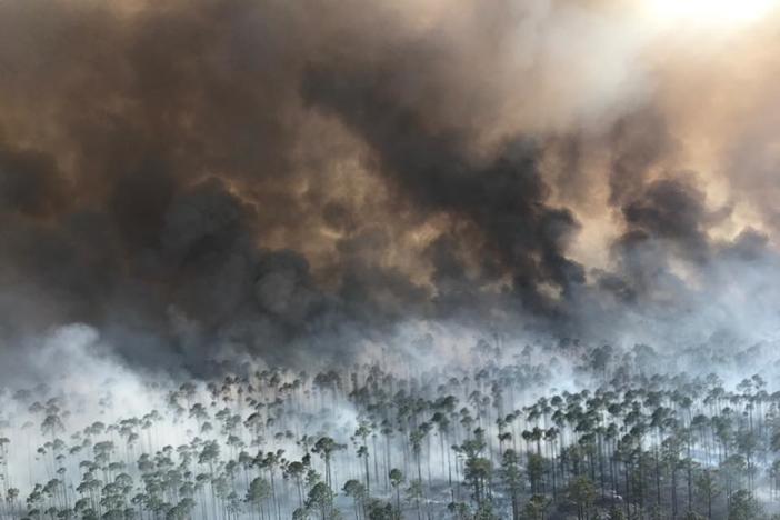 Sustained winds up to 8 mph were expected to keep pushing flames Thursday into areas of swamp parched by drought inside the Okefenokee National Wildlife Refuge, where a lightning strike sparked the blaze April 6.