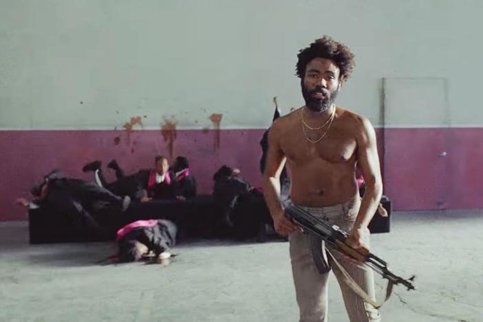 Childish Gambino shoots a choir of black singers in the "This is America" music video, echoing the Charleston church shooting of 2015