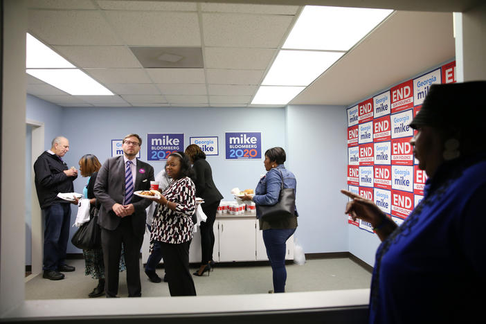 People eat and talk at the opening of the Mike Bloomberg 2020 campaign office in Macon, Ga. on February, 5, 2020. The Bloomberg campaign is opening 8 offices across the state. 