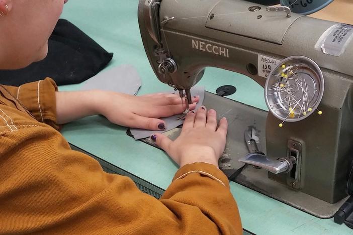 Atlanta Opera costume shop employees begin making masks for healthcare workers.