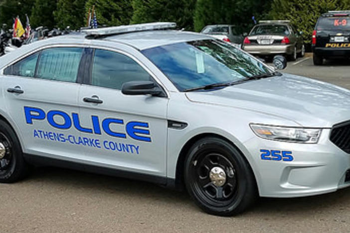 Two Athens police officers shown restraining a 10-year-old in a viral video have been cleared of accusations of excessive force.