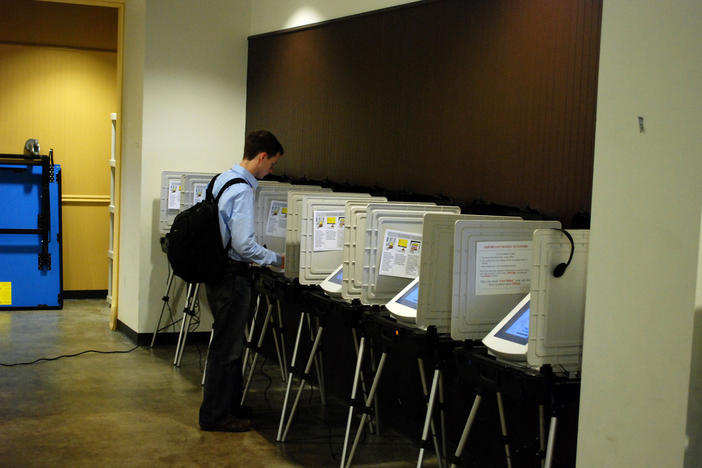 A voter chooses his pick for Atlanta mayor at a polling station at Georgia Tech.