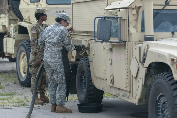 Georgia Army National Guardsman Spc. Stephanie Smith, a fueler with the Ellenwood-based Alpha Company 348th Brigade Support Battalion fuels vehicles during final preparations for Hurricane Dorian response at Fort Stewart, Ga., Sept. 4, 2019. 