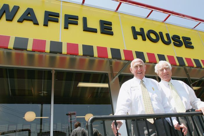 In this file photo taken July 26, 2005, Waffle House founders Joe Rogers Sr., left, and Thomas Francis Forkner Sr. pose in front of a Waffle House restaurant after eating lunch at the establishment in Norcross, Ga. Forkner died Wednesday, April 26, 2017.