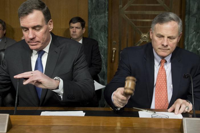 Sen. Richard Burr (right), Republican of NC and chairman of the Senate Select Committee on Intelligence, arrives alongside Sen. Mark Warner, Democrat of Virginia and Committee vice chairman, for a hearing on Russian intelligence activities on March 30.