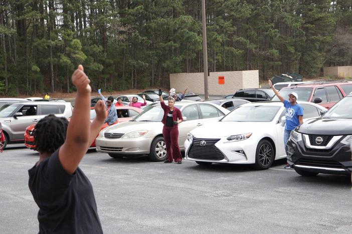 Churchgoers attend service while abiding to social distancing orders.