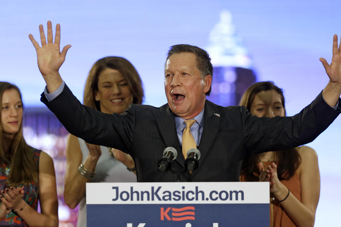 Republican presidential candidate Ohio Gov. John Kasich speaks at his presidential primary election night rally in Berea, Ohio, on Tuesday, March 15, 2016. His wife, Karen, and daughters, Emma, left, and Reese listen. 