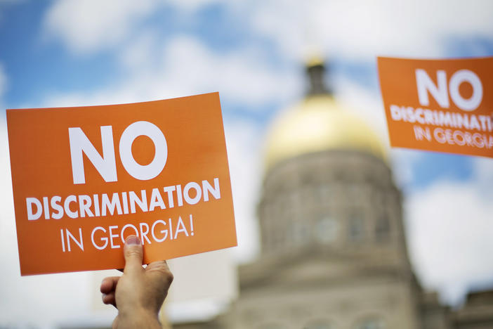 Protestors rally at the state Capitol in opposition to "religious liberty" legislation in 2015.