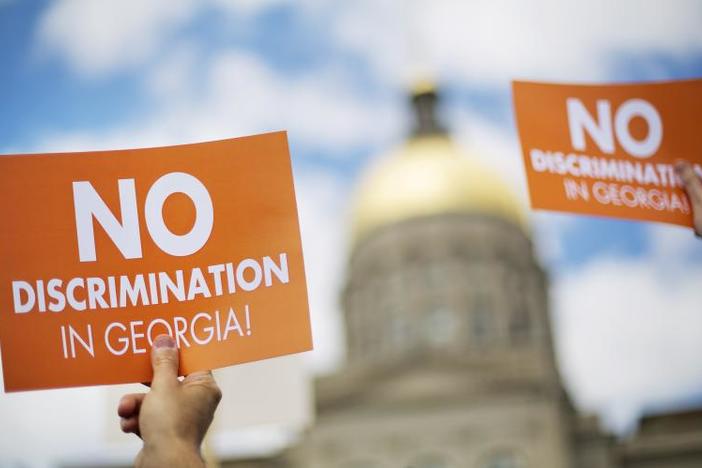 Protestors rally at the state Capitol in opposition to "religious liberty" legislation in 2015.