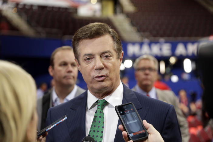 In this July 17, 2016 file photo, Trump Campaign Chairman Paul Manafort talks to reporters on the floor of the Republican National Convention at Quicken Loans Arena, Sunday, in Cleveland.