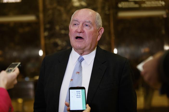 Former Georgia Gov. Sonny Perdue talks with reporters after meeting with President-elect Donald Trump at Trump Tower, Wednesday, Nov. 30, 2016, in New York. 
