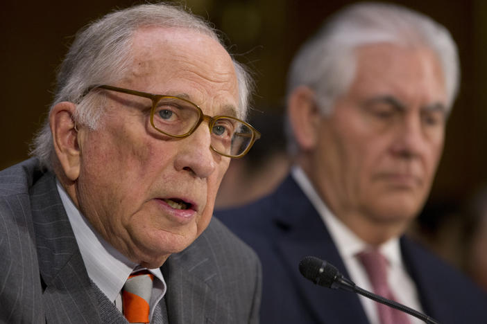 Secretary of State-designate Rex Tillerson listens as right as former Georgia Sen. Sam Nunn introduces him on Capitol Hill in Washington, Wednesday, Jan. 11, 2017, during Tillerson's confirmation hearing before the Senate Foreign Relations Committee. 