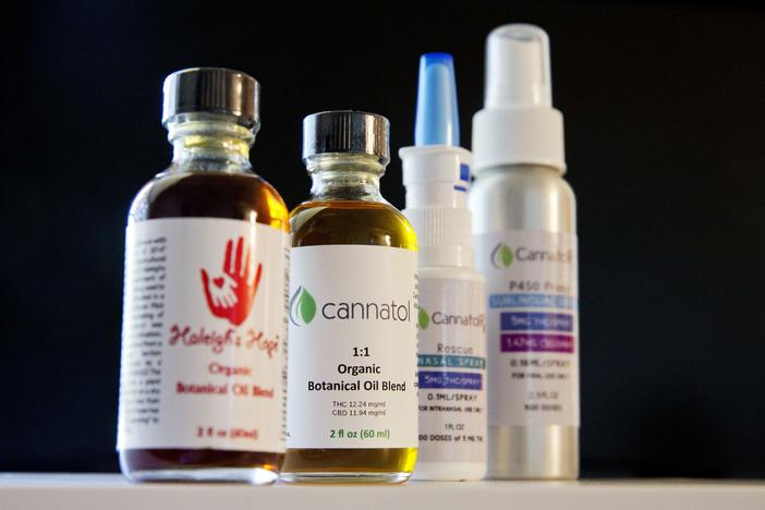 In this  photo, various cannabis oil products are displayed in the office of Georgia State Rep. Allen Peake, R - Macon, in Macon, Ga. Peake is at the center of a semi-legal statewide medical cannabis distribution network.
