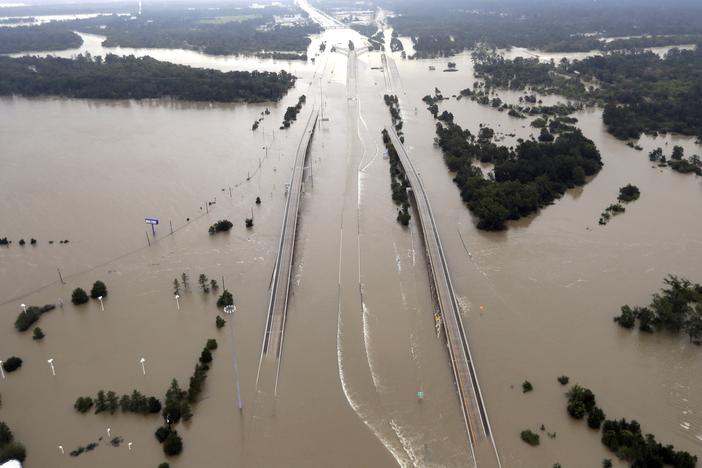 In this Aug. 29, 2017 file photo, Interstate 69 is covered by floodwaters from Harvey, in Humble, Texas. 