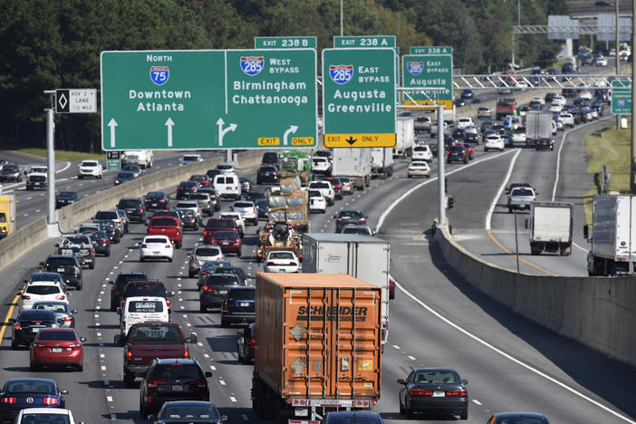 In this photo from Sept. 8, 2017, heavy traffic on Interstate 75 moves slowly in Forrest Park, South of Atlanta. 