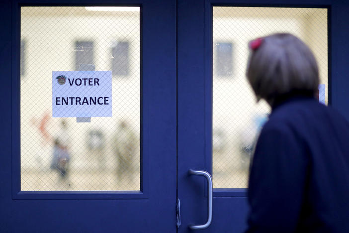 A voter enters a polling site in Atlanta, Tuesday, Nov. 7, 2017.