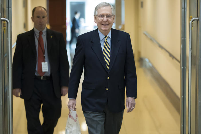 Senate Majority Leader Mitch McConnell, R-Ky., walks through the Capitol as lawmakers return to work after their Thanksgiving break to face unfinished business on taxes and spending, in Washington, Monday, Nov. 27, 2017. 