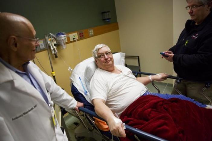 Ken McCarty, center, and his wife Martha Anne, right, talk to Dr. Anthony Marchetti while being treated for the flu at Upson Regional Medical Center in Thomaston, Ga., Friday, Feb. 9, 2018.