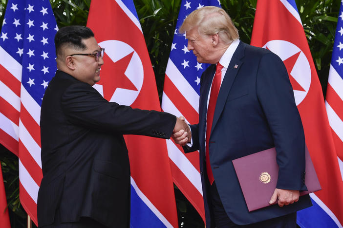North Korea leader Kim Jong Un and U.S. President Donald Trump shake hands at the conclusion of their meetings at the Capella resort on Sentosa Island Tuesday, June 12, 2018 in Singapore.