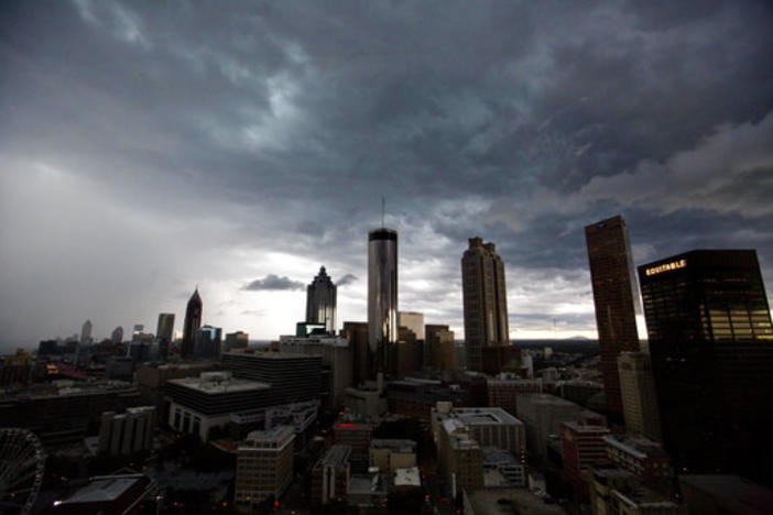A storm cloud passes over the downtown skyline in Atlanta, Monday, June 25, 2018. Strong thunderstorms hit the evening rush hour commute with dark skies and heavy rains.