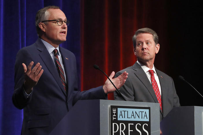 Republican candidates for Georgia Governor Georgia Lt. Gov. Casey Cagle, left, and Secretary of State Brian Kemp speak during an Atlanta Press Club debate at Georgia Public Television Thursday, July 12, 2018, in Atlanta.