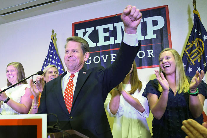 Georgia Republican gubernatorial runoff candidate Brian Kemp goes on stage to declare victory against Casey Cagle during an election night party, Tuesday, July 24, 2018, in Athens, Ga.