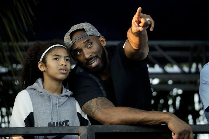 Kobe Bryant and his daughter Gianna watch the U.S. national championships swimming meet Thursday, July 26, 2018, in Irvine, Calif.