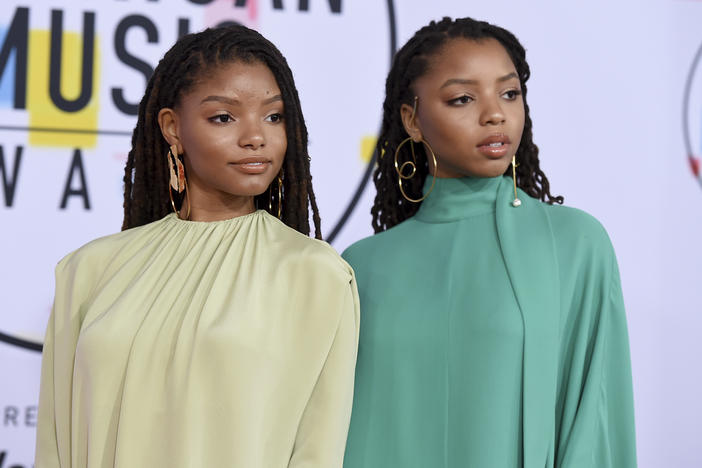 Halle Bailey, left, and Chloe Bailey, of Chloe x Halle, arrive at the American Music Awards on Tuesday, Oct. 9, 2018, at the Microsoft Theater in Los Angeles. 