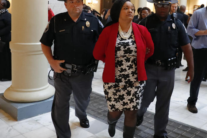 Sen. Nikema Williams (D-Atlanta) is arrested by capitol police during a protest over election ballot counts in the rotunda of the state capitol building Tuesday, Nov. 13, 2018, in Atlanta.