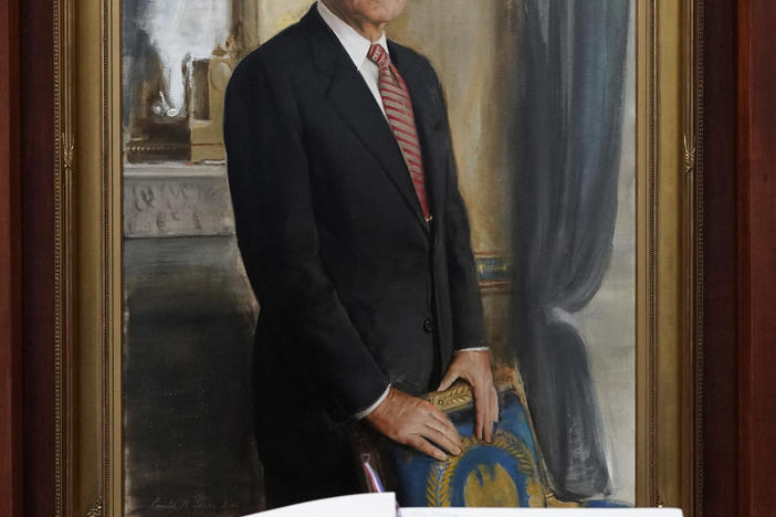 A condolence book sits in front of a painting of George H.W. Bush inside the George H.W. Bush Library and Museum Saturday, Dec. 1, 2018, in College Station. Bush has died at age 94. 