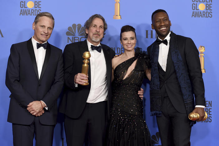 Viggo Mortensen, from left, Peter Farrelly, Linda Cardellini and Mahershala Ali pose in the press room with the award for best motion picture, musical or comedy for "Green Book" at the 76th annual Golden Globe Awards.