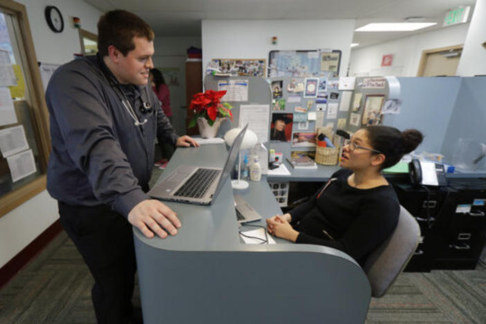 Dr. Alex Kivimaki, left, talks with Dr. Andrea Bachhuber-Beam, as they work at a clinic offering health care and other services operated by the Seattle Indian Health Board, Friday, Jan. 11, 2019, in Seattle.