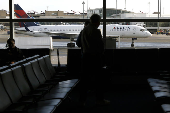 In this Feb. 1, 2019, file photo, a Delta Air Lines jetliner taxis at Logan International Airport in Boston. Delta will temporarily suspend service at 10 airports starting May 13, 2020.