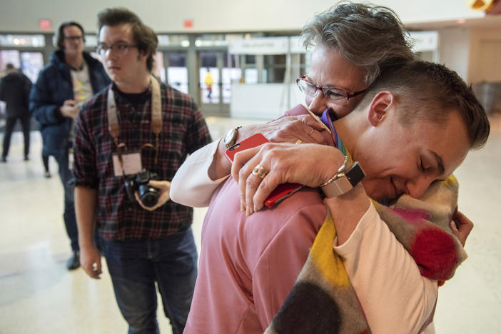 JJ Warren of New York embraces Julie Arms Meeks of Atlanta during protests outside the United Methodist Church's 2019 Special Session of the General Conference in St. Louis, Mo., Tuesday, Feb. 26, 2019. 