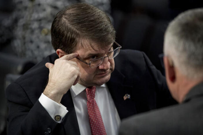 Veterans Affairs Secretary Robert Wilkie, left, speaks with Veterans Health Administration Executive in Charge Dr. Richard Stone, right.