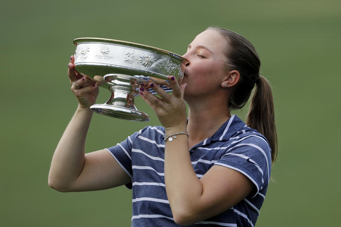 Jennifer Kupcho kisses the trophy after winning the Augusta National Women's Amateur golf tournament in Augusta, Ga., Saturday, April 6, 2019.