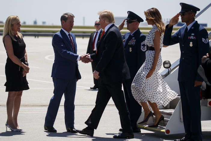 Gov. Brian Kemp and his wife Marty Kemp greet President Donald Trump and first lady Melania Trump as they arrive at Hartsfield-Jackson International Airport to attend the "Rx Drug Abuse and Heroin Summit," Wednesday April 24, 2019, in Atlanta.