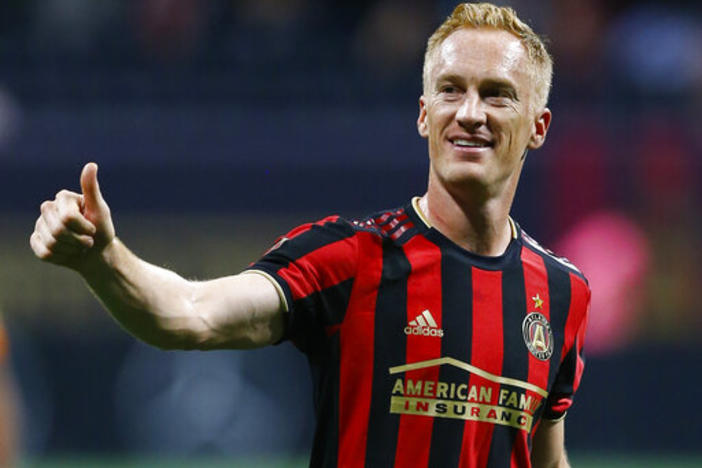 Atlanta United midfielder Jeff Larentowicz gestures to the crowd after the team's MLS soccer match against Toronto FC in Atlanta on Wednesday, May 8, 2019.