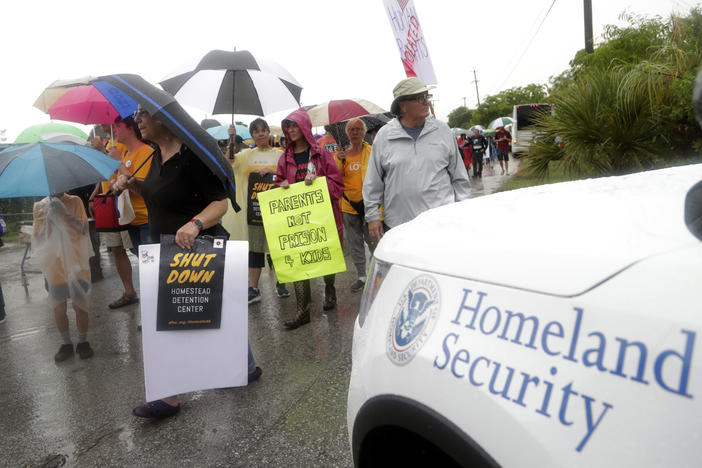 Protestors march outside of the Homestead Temporary Shelter for Unaccompanied Children, Sunday, June 16, 2019, in Homestead, Fla. A coalition of religious groups and immigrant advocates said they want the Homestead detention center closed.