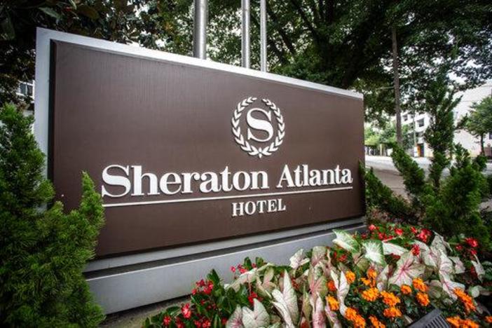 The sign at the entrance to the Sheraton Atlanta Hotel is seen on Wednesday, July 31, 2019, in Atlanta, Georgia. The hotel was shut down voluntarily in July of 2019 after three guests tested positive for Legionnaires' disease.