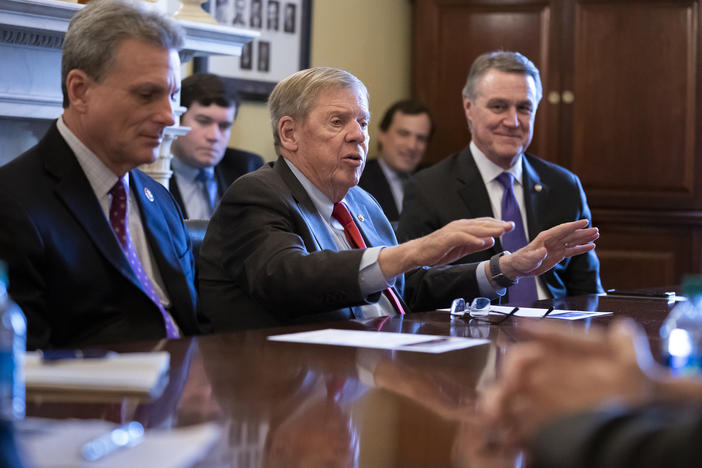 Sen. Johnny Isakson, R-Ga., flanked by Rep. Buddy Carter R-Ga., left, and Sen. David Perdue, R-Ga., right, leads a meeting on Capitol Hill in Washington. 
