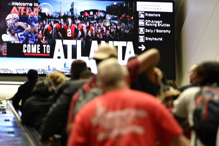 Travelers move in Hartsfield-Jackson Atlanta International Airport , Monday, Sept. 9, 2019, in Atlanta. 