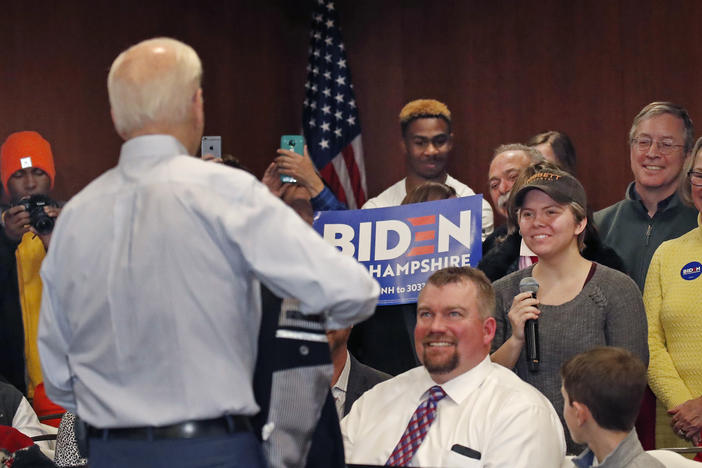 Democratic presidential candidate and former Vice President Joe Biden listens to a question from Madison Moore, at right with microphone, at a campaign event, Sunday, Feb. 9, 2020.