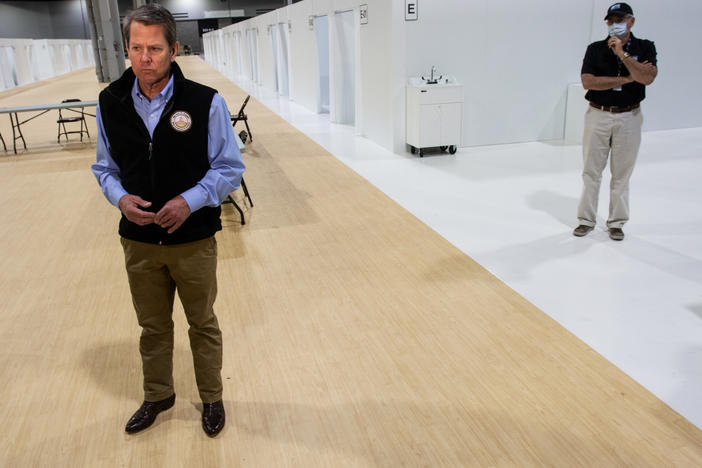Georgia Gov. Brian Kemp listens to a question from the press during a tour of a massive temporary hospital at the Georgia World Congress Center on Thursday, April 16, 2020.