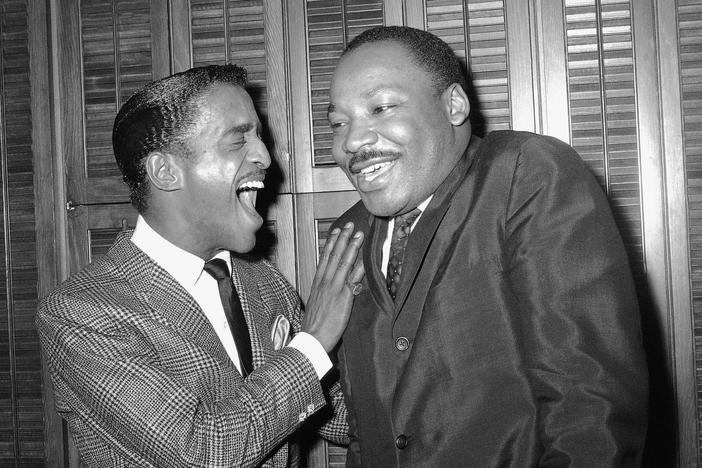 Rev. Dr. Martin Luther King and Entertainer Sammy Davis Jr share a laugh in Davis' dressing room at New York's Majestic Theatre March 4 1965.
