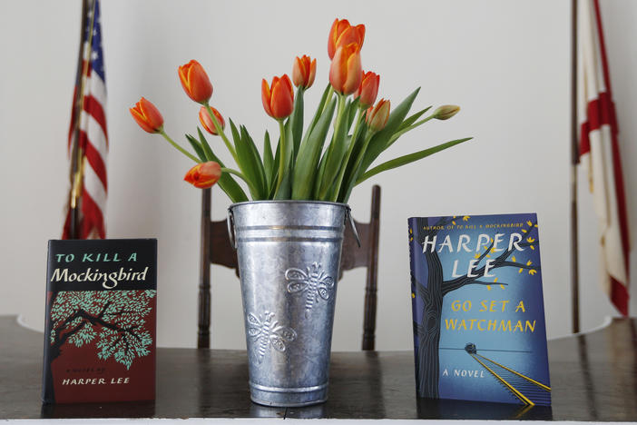 Harper Lee's two books, "To Kill a Mockingbird," and "Go Set A Watchman" are displayed with a bouquet of tulips in the Monroe County Heritage Museum old courthouse Friday, Feb. 19, 2016, in Monroeville, Ala. 